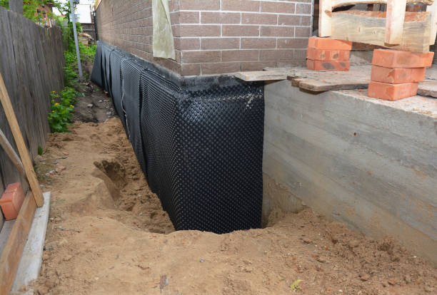 SJ Waterproofing Pros technician performing targeted Exterior Waterproofing assessment in Lawrenceville, VA